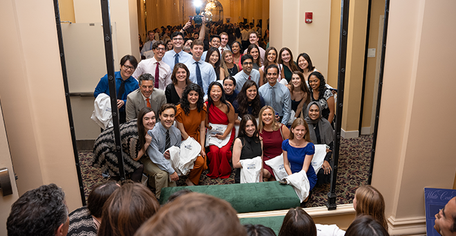 Largest T.H. Chan School of Medicine class cloaked in symbol of service at White Coat Ceremony