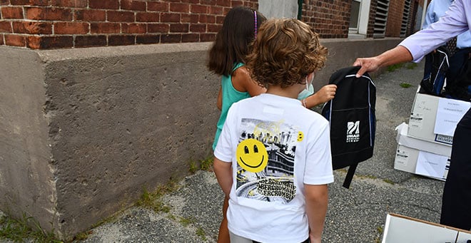 Worcester elementary students greeted with supply-filled backpacks from UMass Medical School