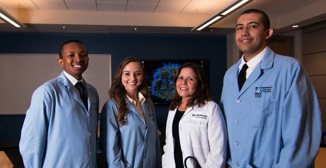 Summer Enrichment Program Class of 2016 members (from left) Rodney Bruno, Iva Hoxha and Alex Mills with Associate Professor of Medicine and UMMS admissions committee member Maria Garcia, MD, MPH (second from right).